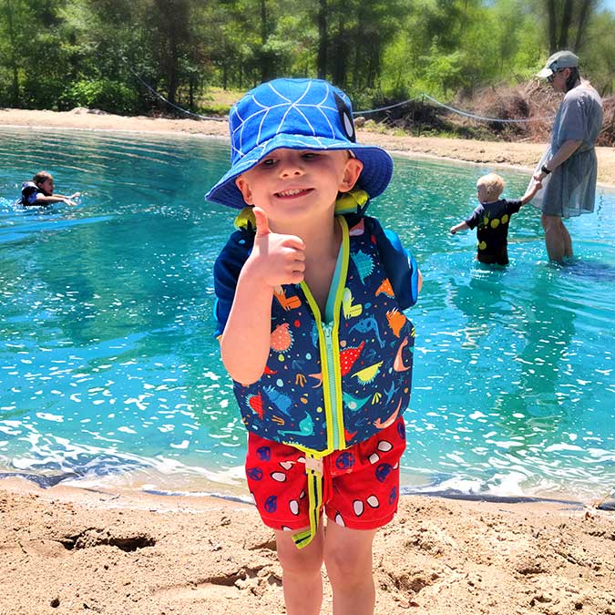 Kids give the thumbs up for approval of the Castle Rock Lake Campground campsites with swimming pond